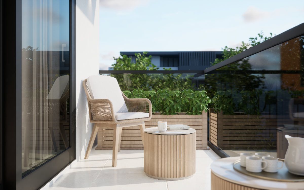 Balkon mit Sitzplatz und Blick ins Grüne